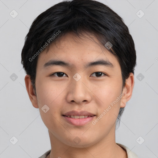 Joyful asian young-adult male with short  brown hair and brown eyes