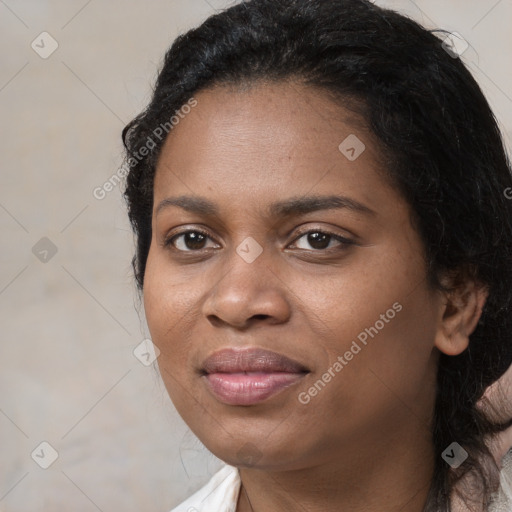 Joyful black young-adult female with medium  black hair and brown eyes