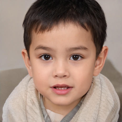 Joyful white child male with short  brown hair and brown eyes