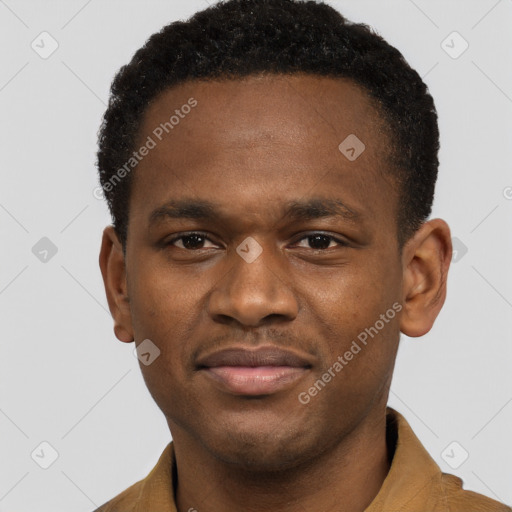 Joyful black young-adult male with short  brown hair and brown eyes