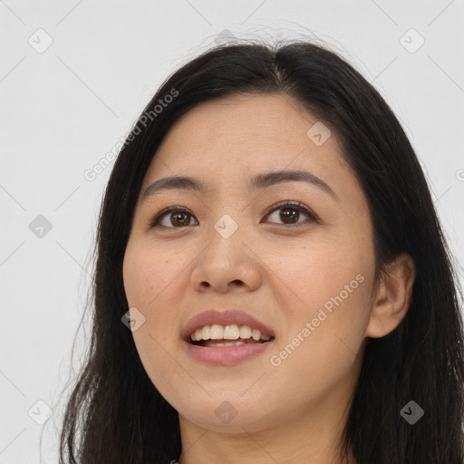 Joyful asian young-adult female with long  brown hair and brown eyes