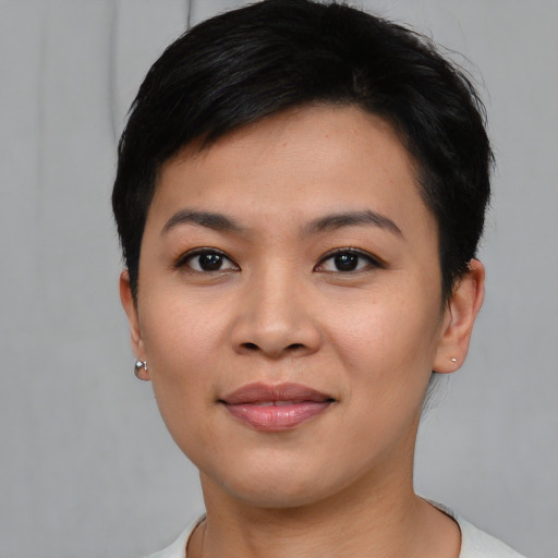 Joyful asian young-adult female with short  black hair and brown eyes