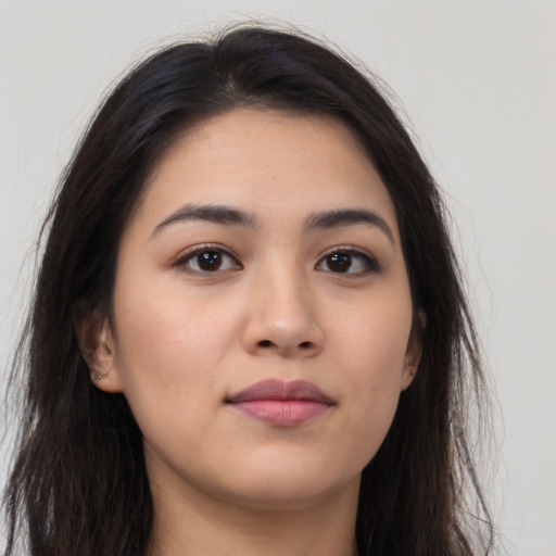 Neutral latino young-adult female with long  brown hair and brown eyes