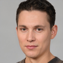 Joyful white adult male with short  brown hair and grey eyes