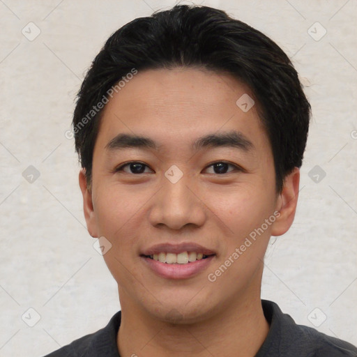 Joyful asian young-adult male with short  black hair and brown eyes