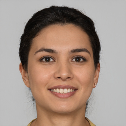 Joyful white young-adult female with medium  brown hair and brown eyes