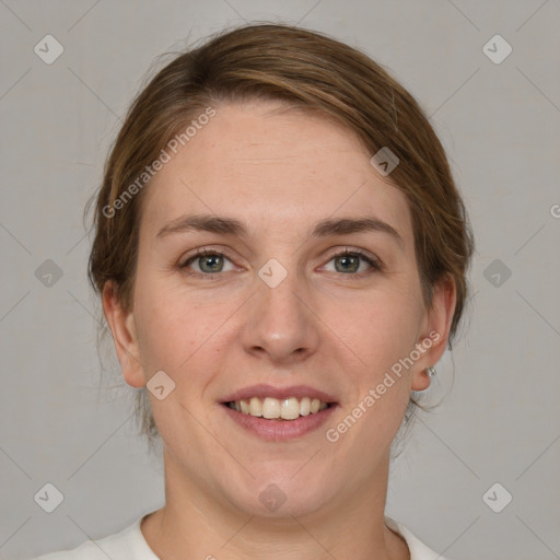 Joyful white young-adult female with medium  brown hair and green eyes