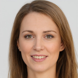 Joyful white young-adult female with long  brown hair and grey eyes