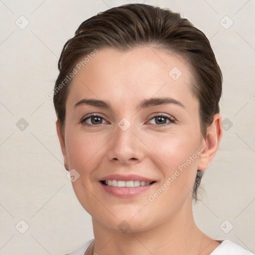 Joyful white young-adult female with short  brown hair and brown eyes