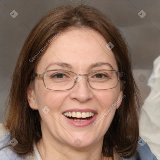 Joyful white adult female with medium  brown hair and blue eyes