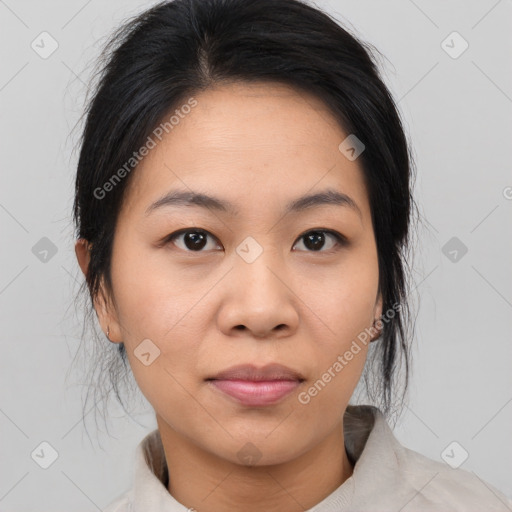 Joyful asian young-adult female with medium  black hair and brown eyes