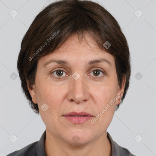 Joyful white adult female with medium  brown hair and grey eyes