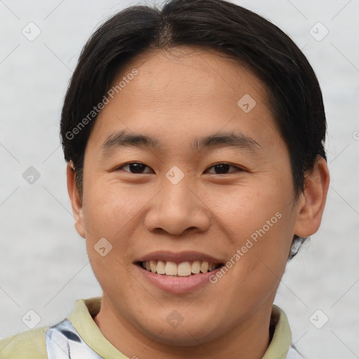 Joyful asian young-adult male with short  brown hair and brown eyes