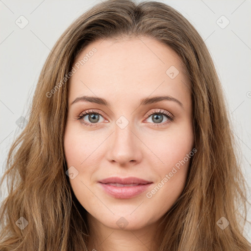 Joyful white young-adult female with long  brown hair and green eyes