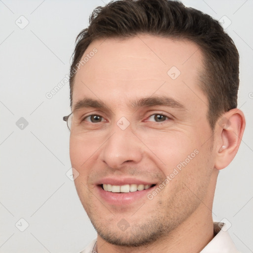 Joyful white young-adult male with short  brown hair and brown eyes