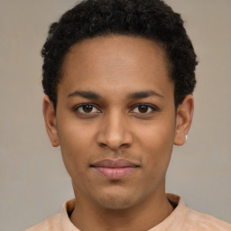 Joyful latino young-adult male with short  brown hair and brown eyes