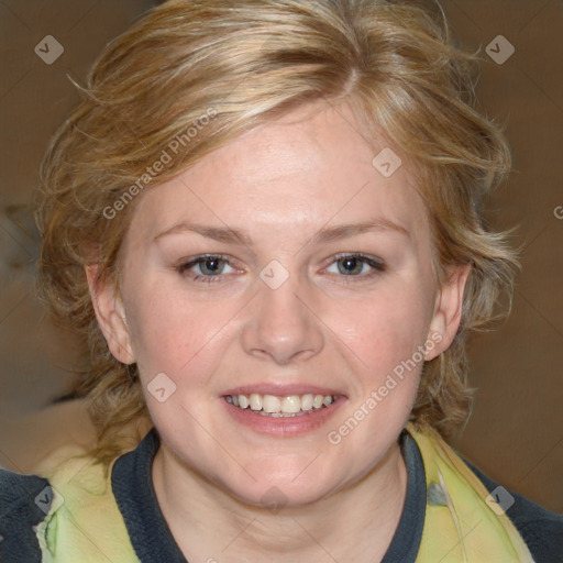 Joyful white adult female with medium  brown hair and blue eyes