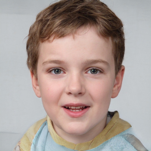 Joyful white child male with short  brown hair and blue eyes