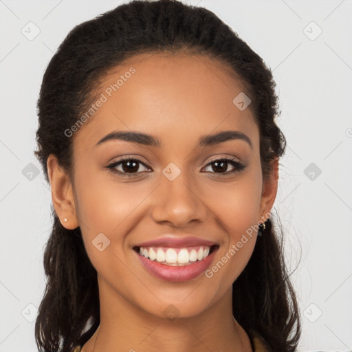 Joyful latino young-adult female with long  brown hair and brown eyes