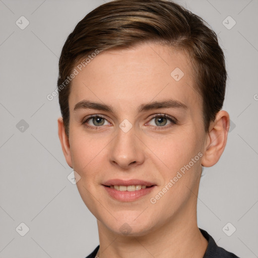 Joyful white young-adult female with short  brown hair and grey eyes