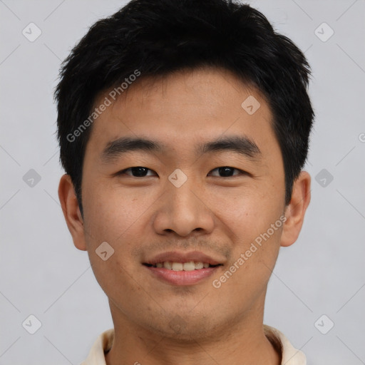 Joyful asian young-adult male with short  black hair and brown eyes