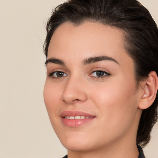 Joyful white young-adult female with medium  brown hair and brown eyes