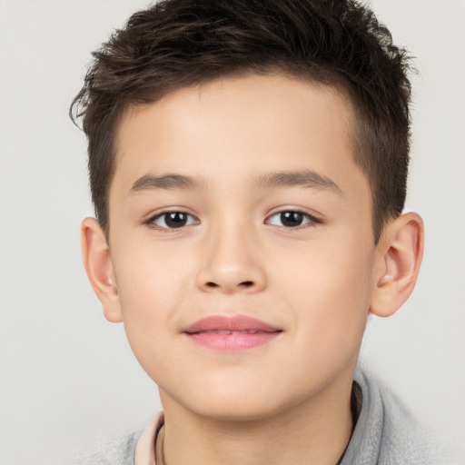 Joyful white child male with short  brown hair and brown eyes