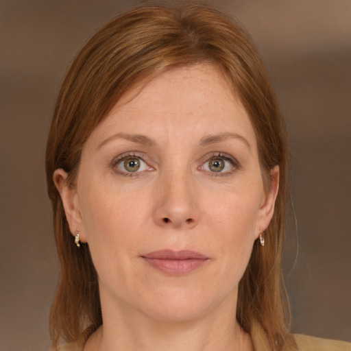 Joyful white adult female with medium  brown hair and grey eyes