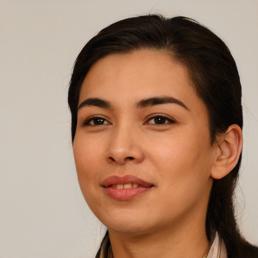 Joyful latino young-adult female with long  brown hair and brown eyes