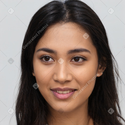 Joyful latino young-adult female with long  brown hair and brown eyes