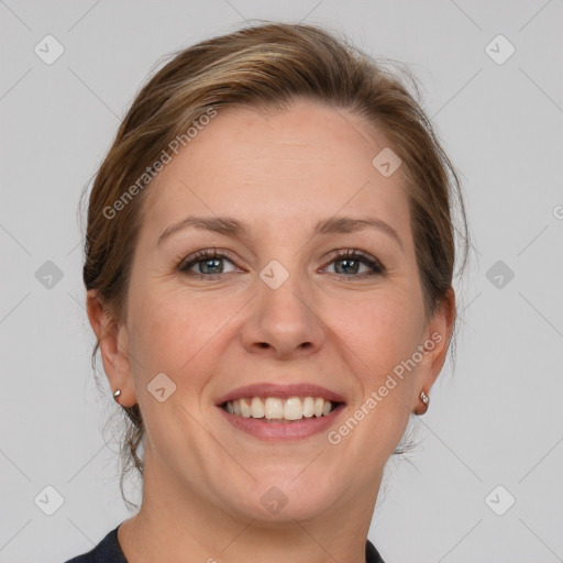 Joyful white young-adult female with medium  brown hair and grey eyes