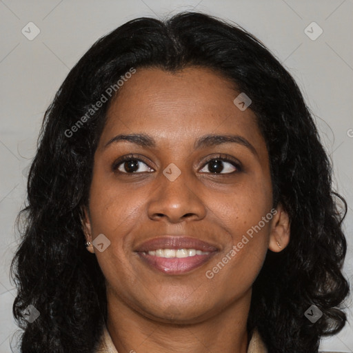 Joyful black young-adult female with long  brown hair and brown eyes