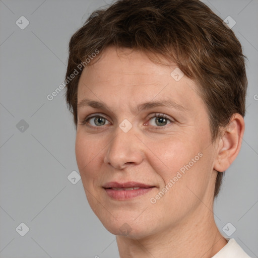 Joyful white adult female with short  brown hair and brown eyes