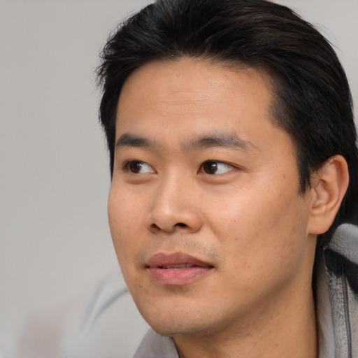 Neutral asian young-adult male with short  black hair and brown eyes