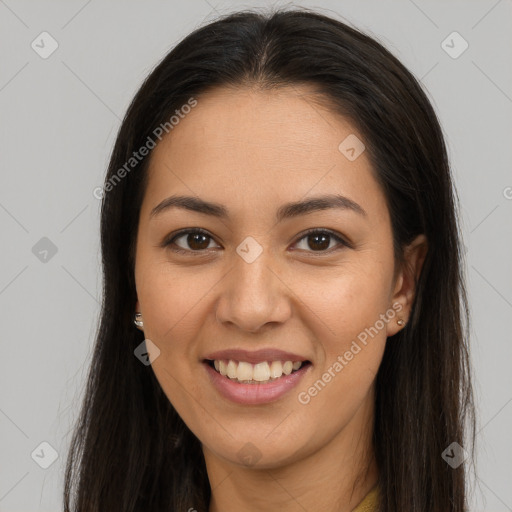 Joyful latino young-adult female with long  brown hair and brown eyes