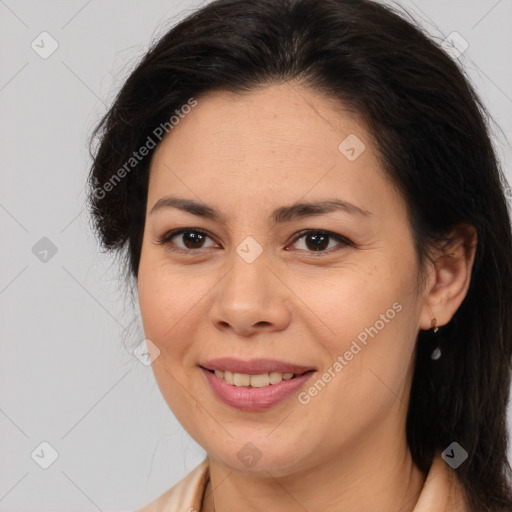 Joyful latino young-adult female with medium  brown hair and brown eyes