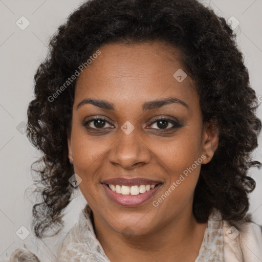 Joyful black young-adult female with long  brown hair and brown eyes