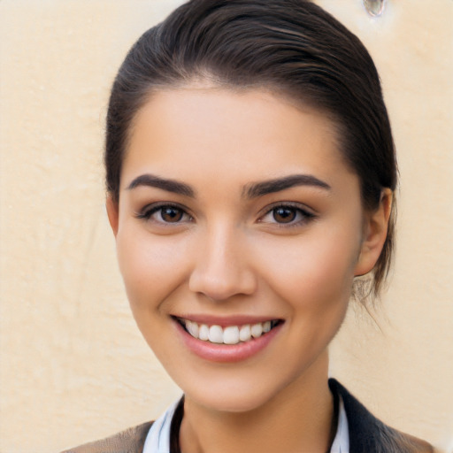 Joyful white young-adult female with medium  brown hair and brown eyes