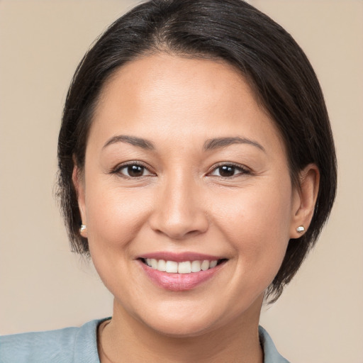 Joyful white young-adult female with medium  brown hair and brown eyes