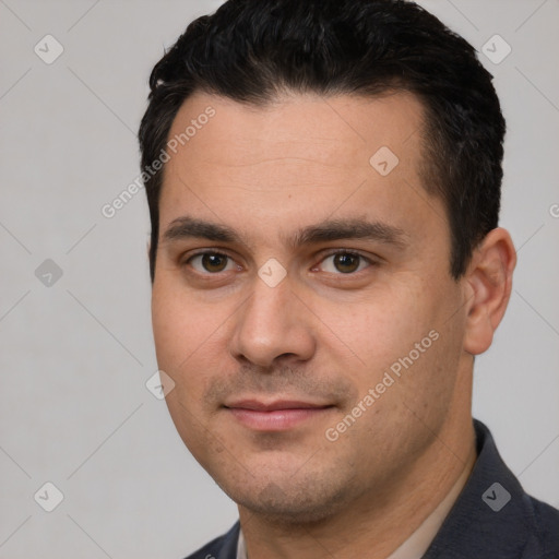 Joyful white young-adult male with short  black hair and brown eyes