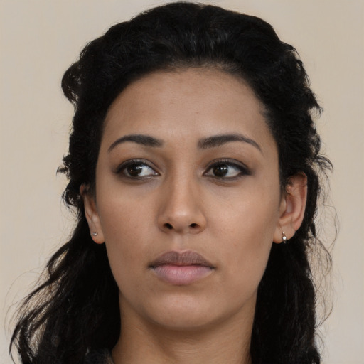 Neutral latino young-adult female with long  black hair and brown eyes
