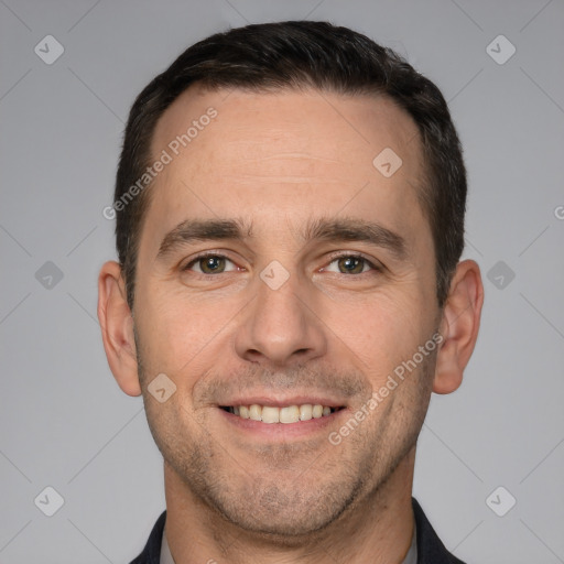 Joyful white adult male with short  brown hair and brown eyes