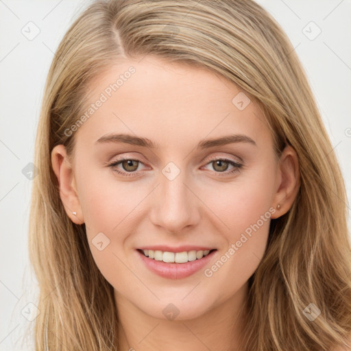 Joyful white young-adult female with long  brown hair and blue eyes