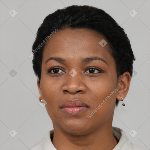 Joyful black young-adult female with short  black hair and brown eyes