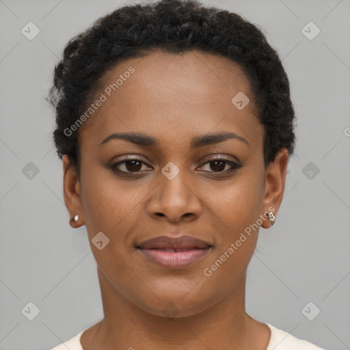 Joyful black young-adult female with short  brown hair and brown eyes