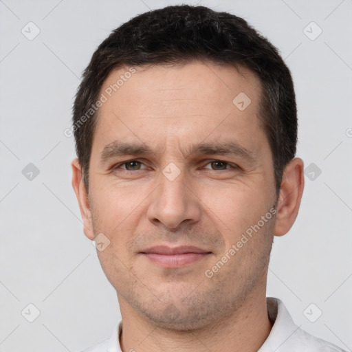 Joyful white adult male with short  brown hair and brown eyes