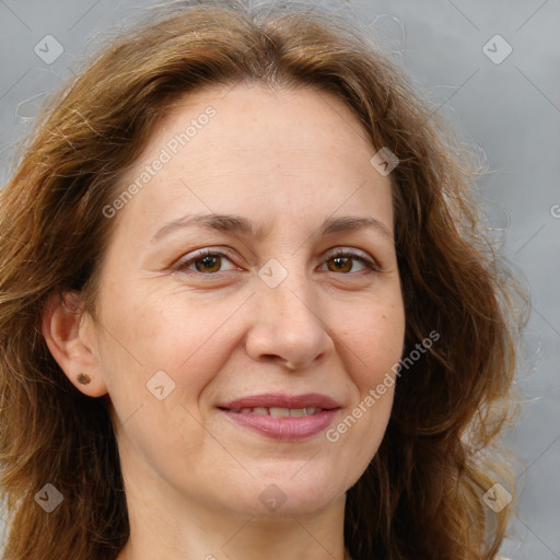 Joyful white adult female with long  brown hair and brown eyes