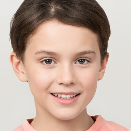 Joyful white child female with short  brown hair and brown eyes