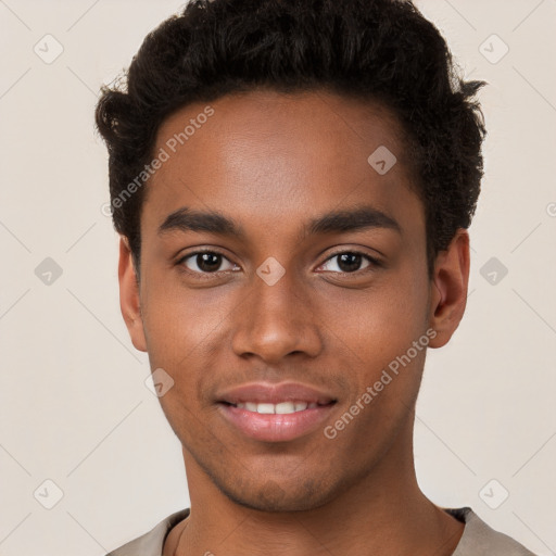 Joyful black young-adult male with short  brown hair and brown eyes