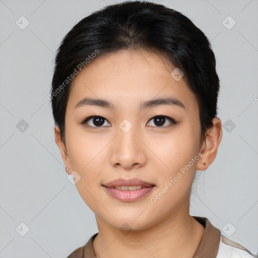 Joyful asian young-adult female with medium  black hair and brown eyes